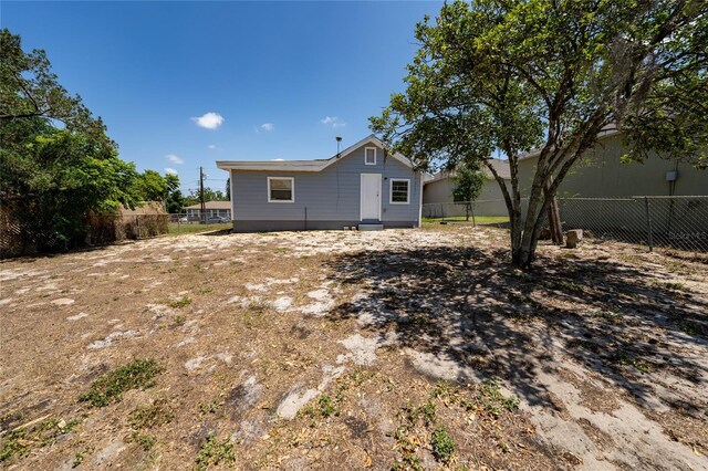 31 Cedar St, Haines City, FL 33844 - rear view of property featuring fence private yard