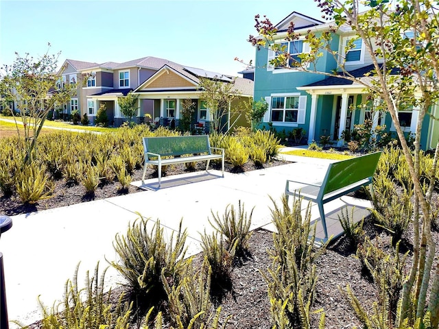 exterior space with a residential view and stucco siding