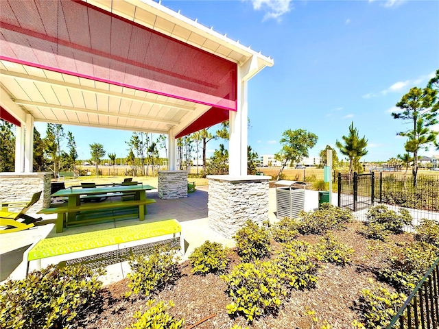 view of community with fence