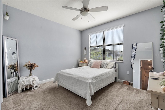 bedroom featuring baseboards, carpet, and a ceiling fan