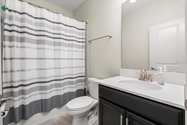 bathroom featuring vanity, tile patterned floors, toilet, and shower / tub combo