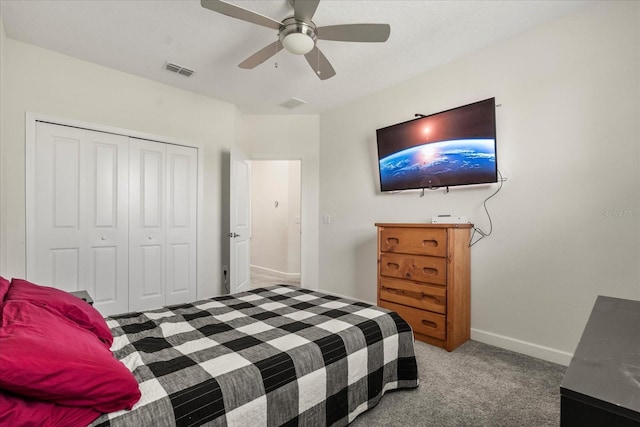 carpeted bedroom featuring baseboards, ceiling fan, a closet, and visible vents