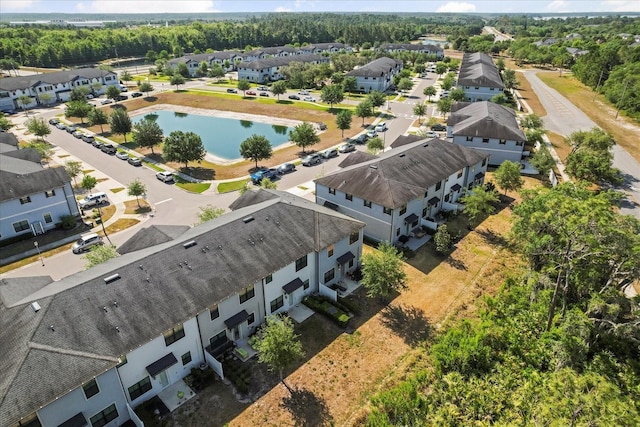 bird's eye view featuring a residential view and a water view