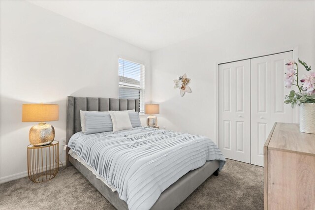 2156 Merrybells Dr, Kissimmee, FL 34746 - carpeted bedroom featuring a closet and baseboards