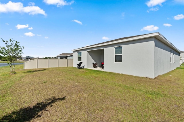 2156 Merrybells Dr, Kissimmee, FL 34746 - rear view of property featuring stucco siding
