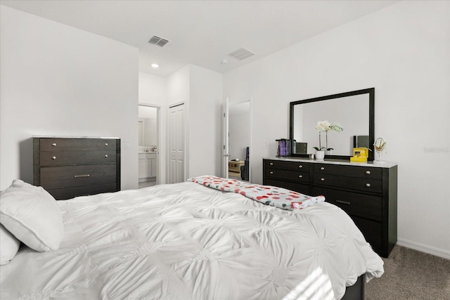 2156 Merrybells Dr, Kissimmee, FL 34746 - carpeted bedroom with ensuite bathroom, baseboards, and recessed lighting