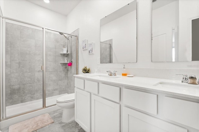 2156 Merrybells Dr, Kissimmee, FL 34746 - bathroom featuring a stall shower, toilet, and double vanity