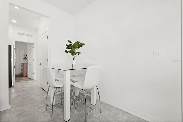 2156 Merrybells Dr, Kissimmee, FL 34746 - dining space featuring baseboards and recessed lighting