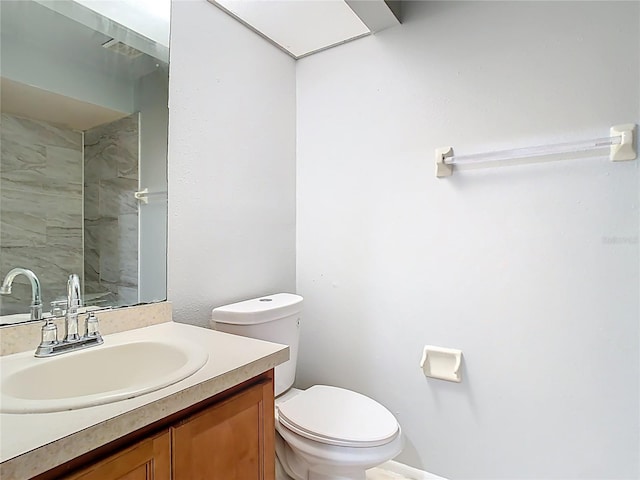bathroom with toilet and vanity