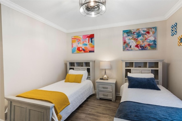 bedroom with ornamental molding and dark wood-style floors