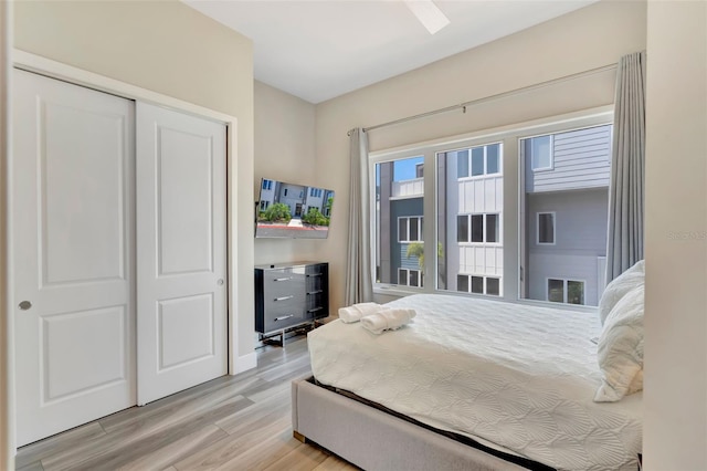 7740 Sandy Ridge Dr Unit 236, Reunion, FL 34747 - bedroom with light wood finished floors and a closet