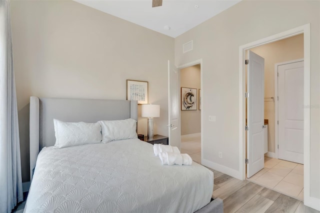 7740 Sandy Ridge Dr Unit 236, Reunion, FL 34747 - bedroom with light wood-type flooring, visible vents, and baseboards
