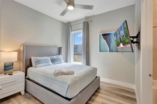 7740 Sandy Ridge Dr Unit 236, Reunion, FL 34747 - bedroom featuring baseboards, light wood finished floors, and ceiling fan