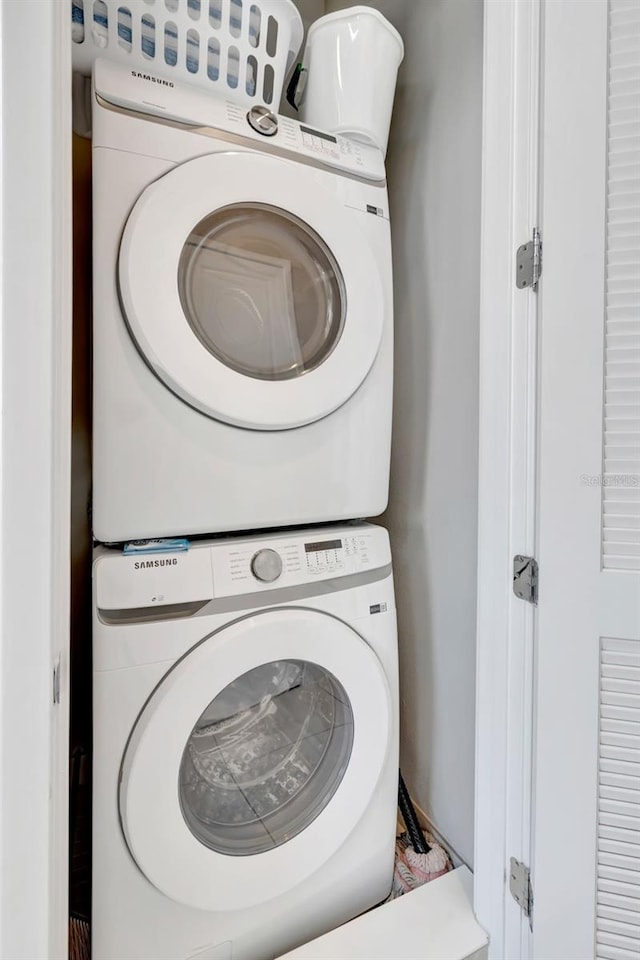 7740 Sandy Ridge Dr Unit 236, Reunion, FL 34747 - washroom featuring laundry area and stacked washer and clothes dryer