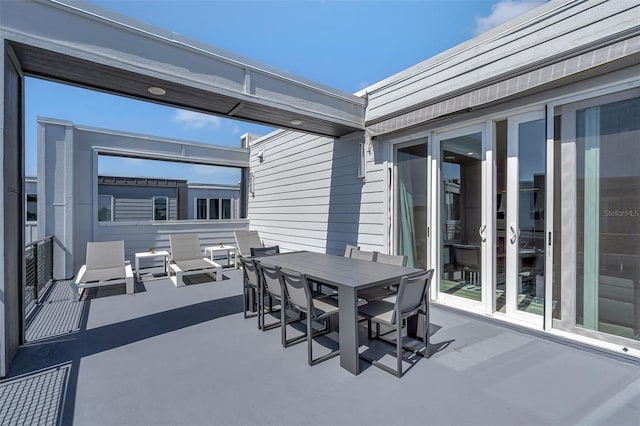7740 Sandy Ridge Dr Unit 236, Reunion, FL 34747 - view of patio featuring outdoor dining area