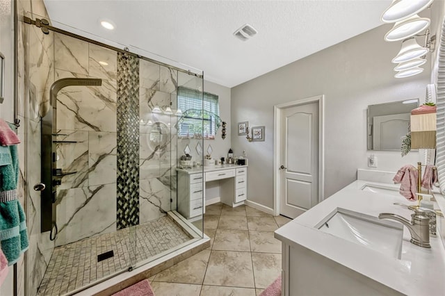 bathroom featuring double vanity, a marble finish shower, a sink, and visible vents