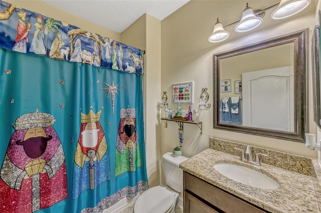 full bath featuring vanity, toilet, a textured ceiling, and a shower with shower curtain