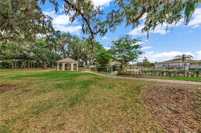 view of yard with a gazebo and fence