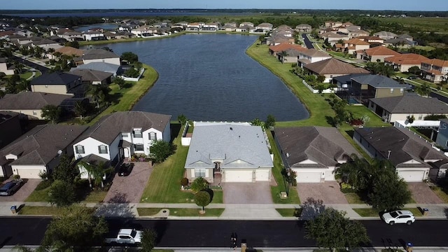 aerial view featuring a residential view and a water view