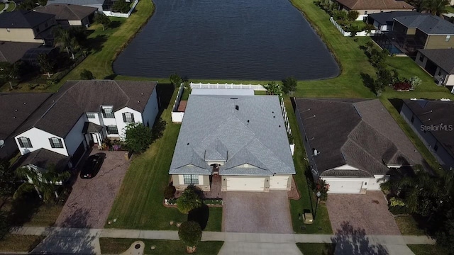 aerial view with a water view and a residential view