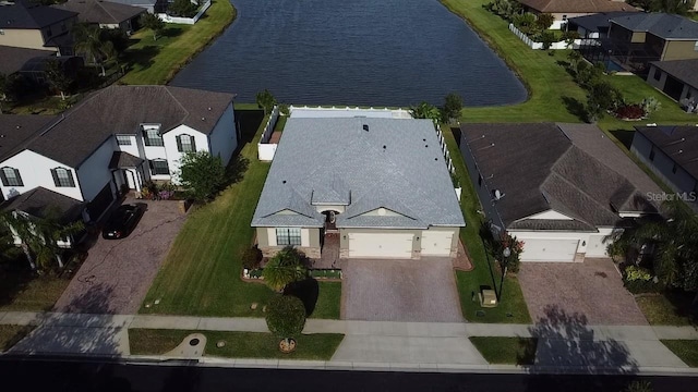 aerial view featuring a water view and a residential view