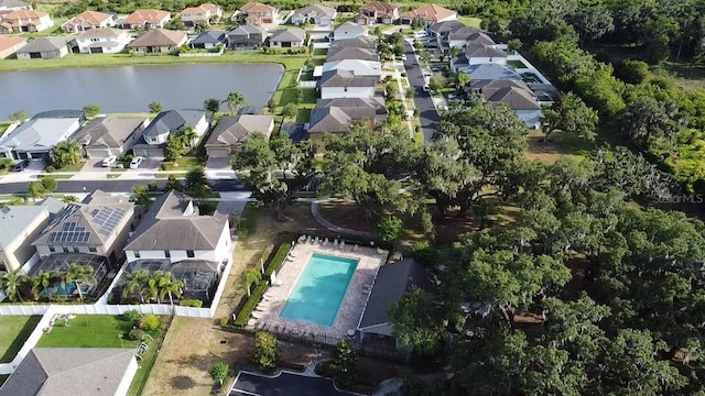 bird's eye view featuring a water view and a residential view