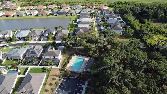 bird's eye view featuring a water view and a residential view