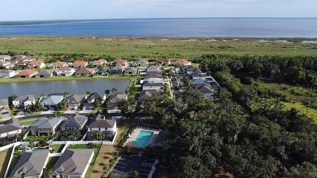 birds eye view of property featuring a water view and a residential view