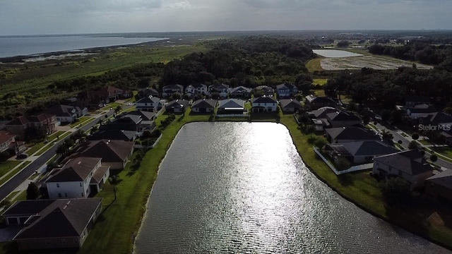 birds eye view of property with a residential view and a water view
