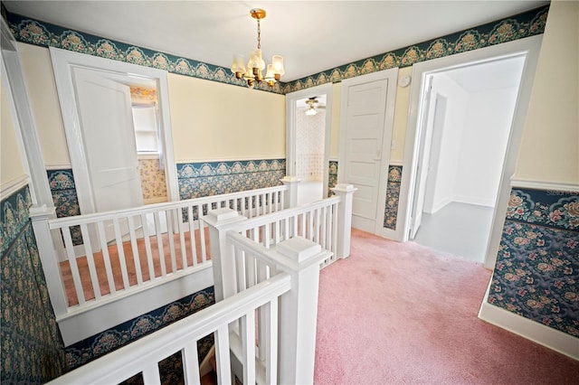 1400 Florida Ave, Saint Cloud, FL 34769 - bedroom with a chandelier, light carpet, and a wainscoted wall