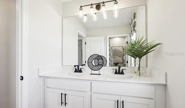 bathroom featuring double vanity and a sink