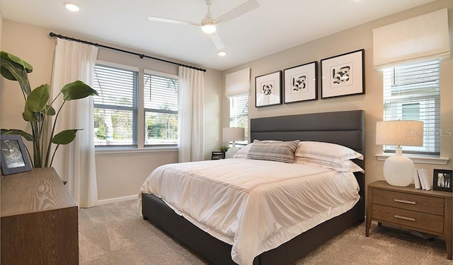 bedroom with recessed lighting, baseboards, and light colored carpet