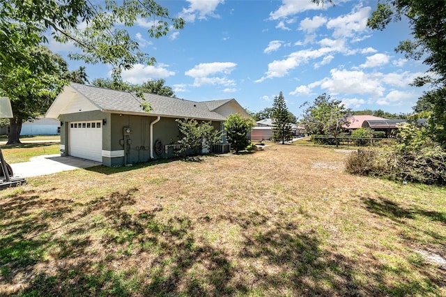 1100 Anne Elisa Cir, Saint Cloud, FL 34772 - view of yard with fence, an attached garage, cooling unit, and driveway