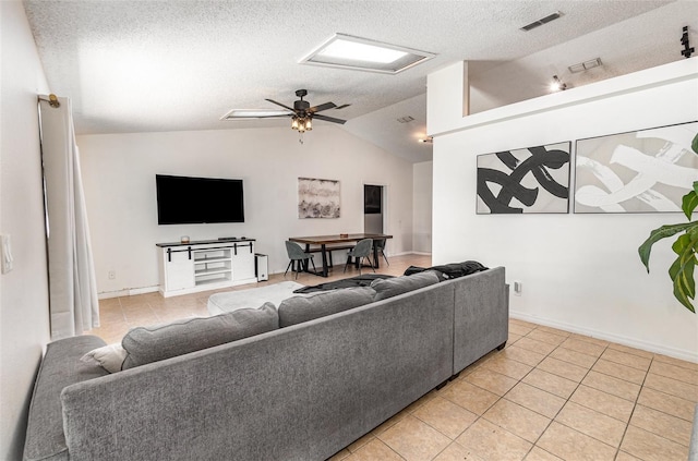 1100 Anne Elisa Cir, Saint Cloud, FL 34772 - living room featuring visible vents, a textured ceiling, lofted ceiling, and light tile patterned flooring