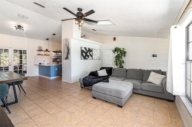 1100 Anne Elisa Cir, Saint Cloud, FL 34772 - living room with visible vents, french doors, a textured ceiling, and lofted ceiling