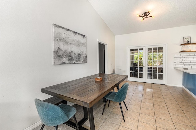 1100 Anne Elisa Cir, Saint Cloud, FL 34772 - dining room featuring vaulted ceiling, baseboards, french doors, and light tile patterned flooring