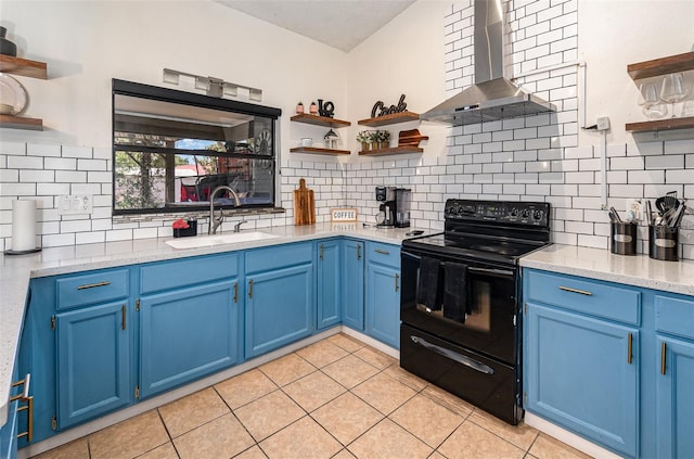 1100 Anne Elisa Cir, Saint Cloud, FL 34772 - kitchen with black range with electric stovetop, open shelves, wall chimney exhaust hood, and blue cabinetry