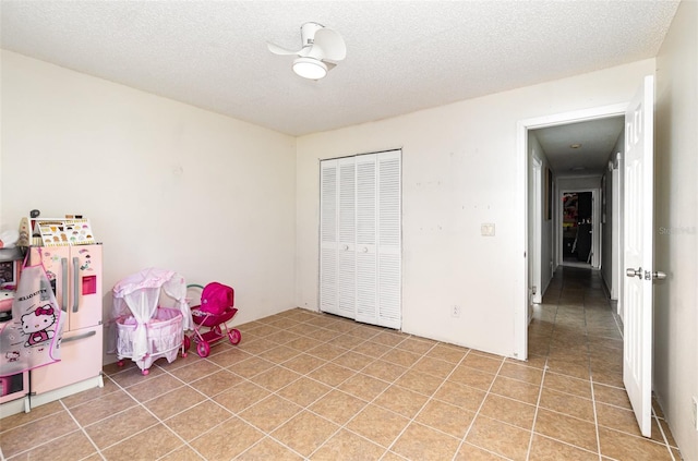 1100 Anne Elisa Cir, Saint Cloud, FL 34772 - rec room with a textured ceiling and light tile patterned floors
