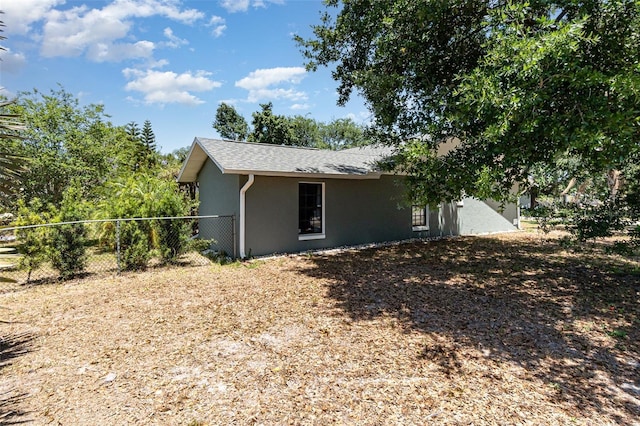 1100 Anne Elisa Cir, Saint Cloud, FL 34772 - view of home's exterior featuring stucco siding and fence