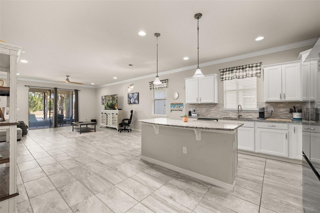 kitchen with white cabinets, recessed lighting, and tasteful backsplash