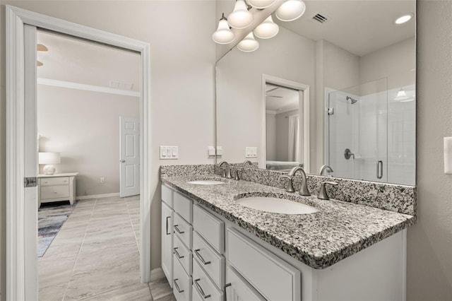 full bath featuring double vanity, a shower stall, a sink, and visible vents