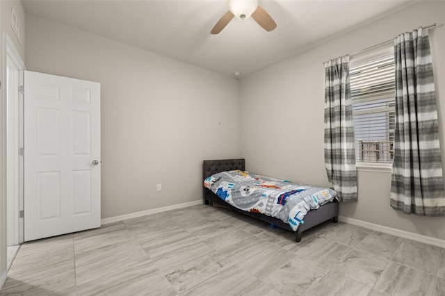 bedroom featuring baseboards, ceiling fan, and visible vents