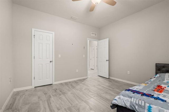 bedroom with baseboards, visible vents, and ceiling fan
