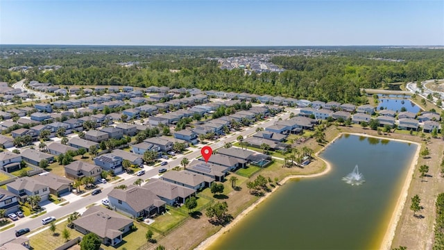 bird's eye view with a residential view and a water view