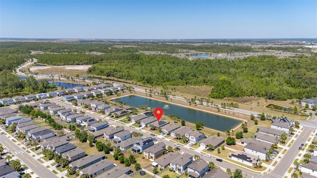 bird's eye view featuring a water view and a forest view