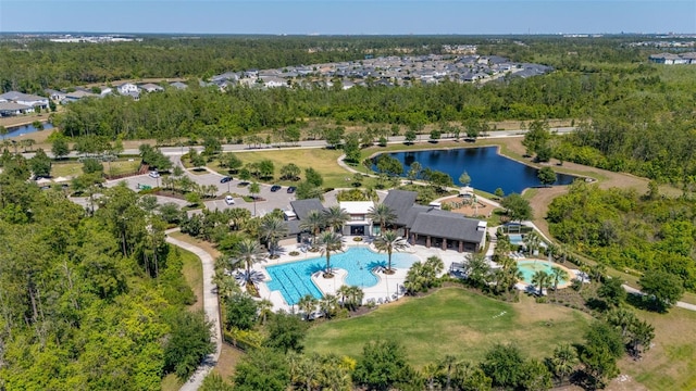 aerial view with a water view and a forest view