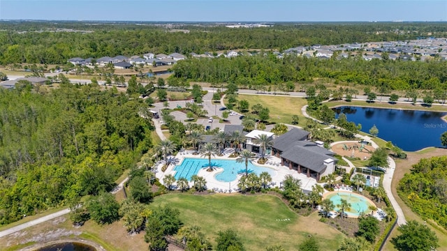 aerial view featuring a water view and a view of trees