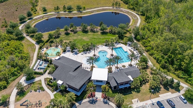 birds eye view of property with a water view