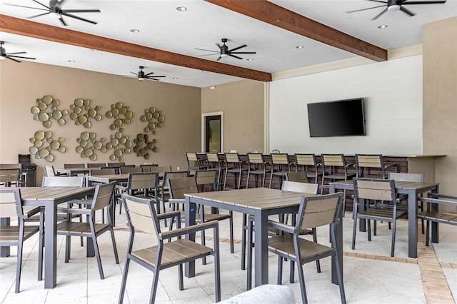 dining area featuring ceiling fan, beamed ceiling, and recessed lighting
