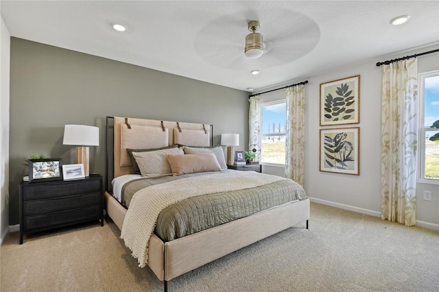 bedroom with baseboards, recessed lighting, and carpet floors